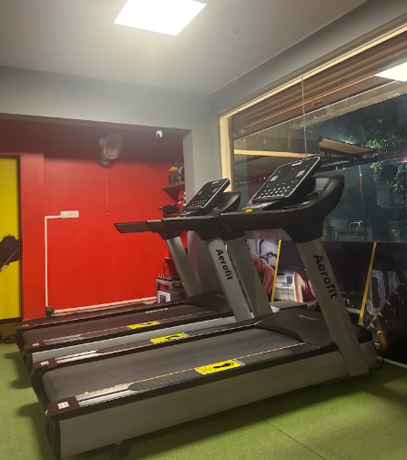Aerofit treadmills facing the street-side window